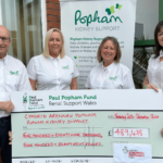 Popham Kidney Support team members Geraint John, Hayley Evans, Gail Williams and its CEO, Joanne Popham, with the cheque presented by the National Lottery