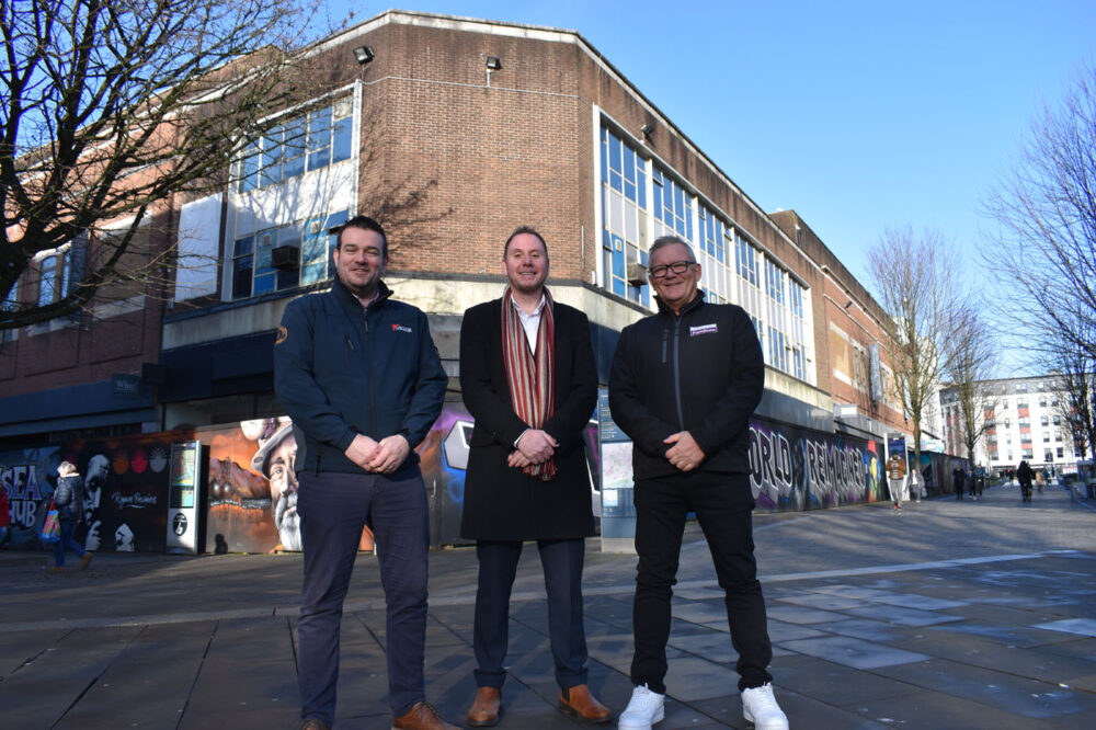 Swansea Council leader Rob Stewart, centre, with Kier Construction senior pre-construction manager Mark Miller, left, and Ministry of Furniture managing director Graham Hirst