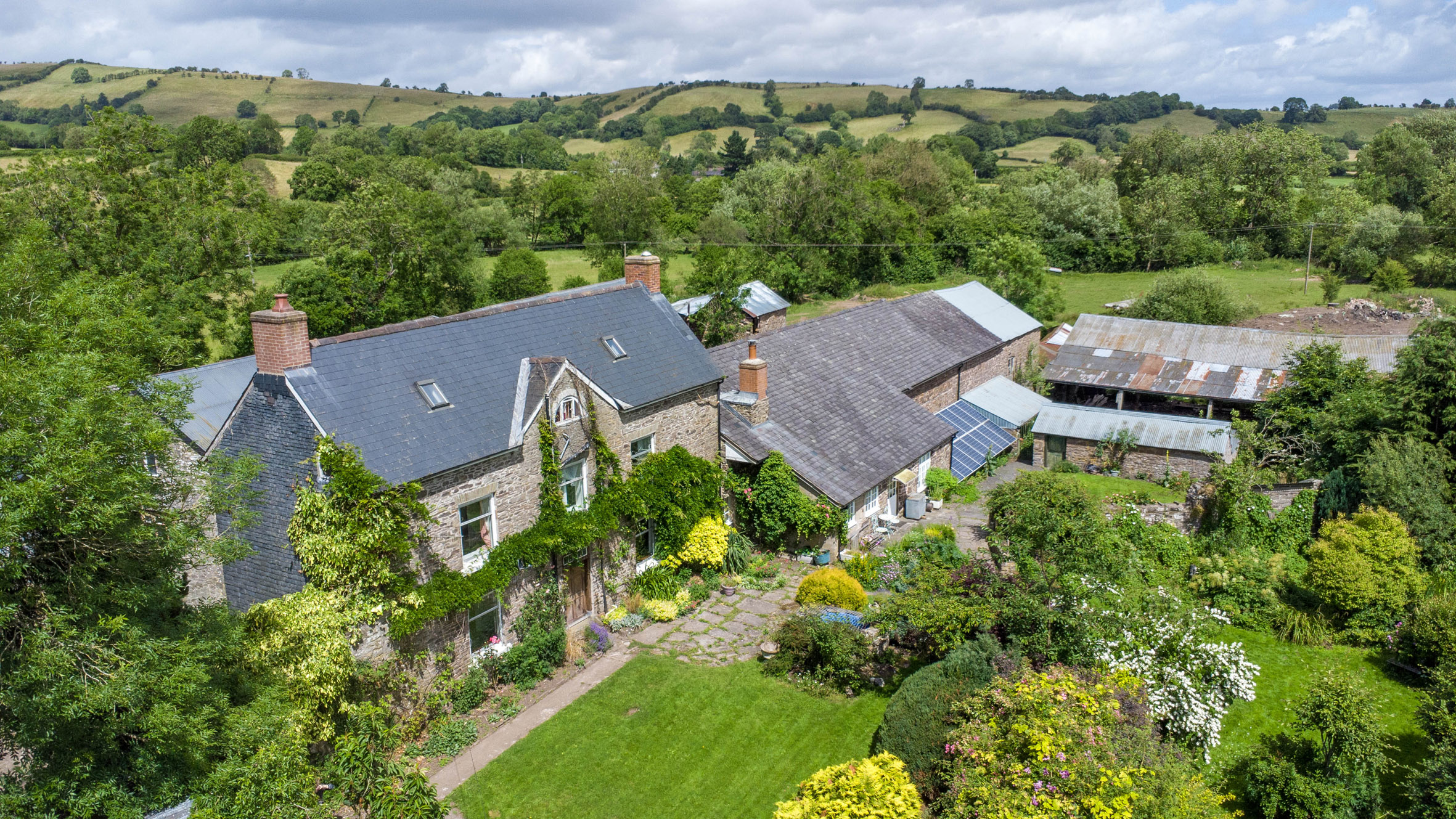 Beautifully situated South Shropshire livestock farm offers three homes in one