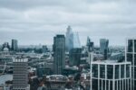 city buildings under white sky during daytime